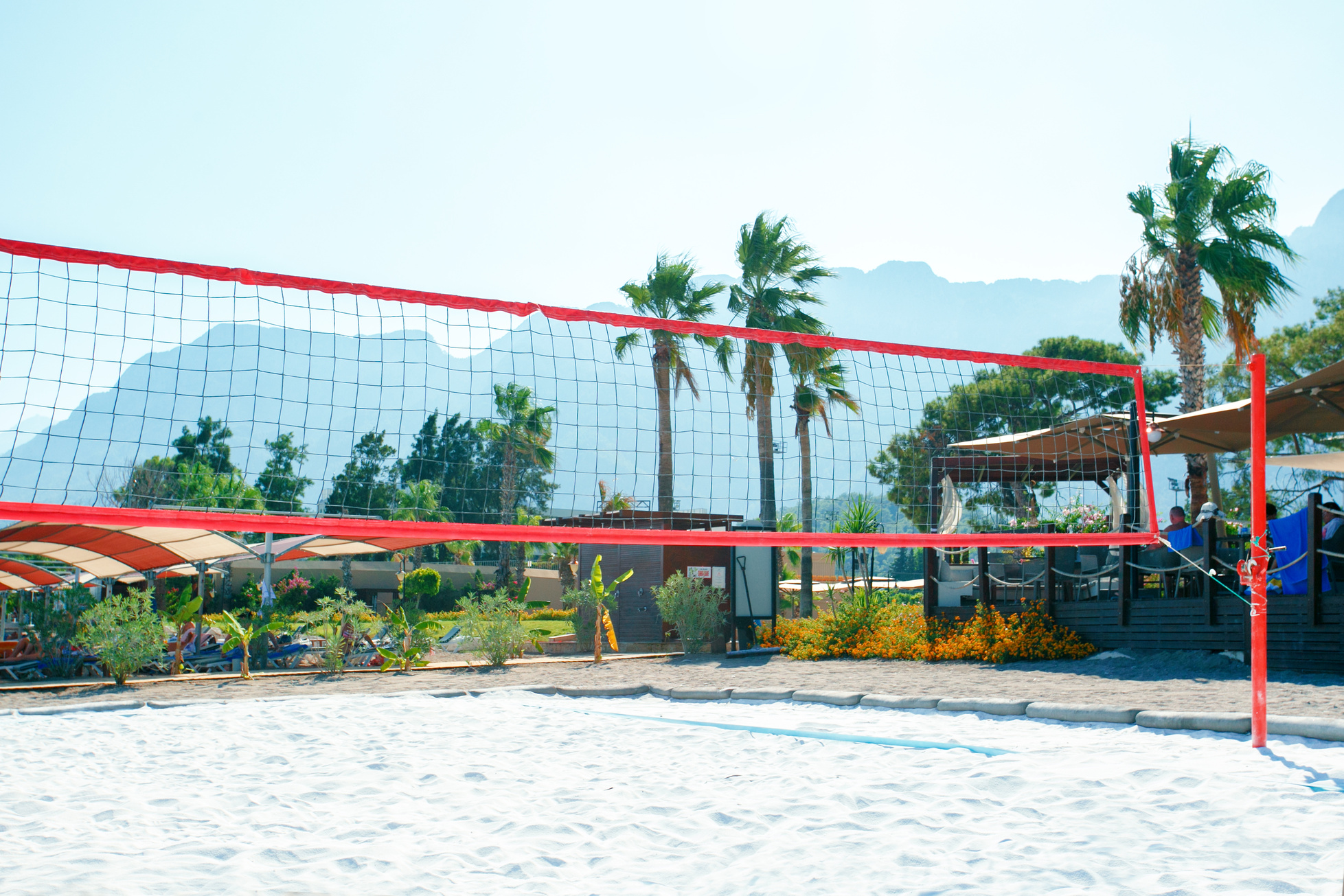 Volleyball net on beach.